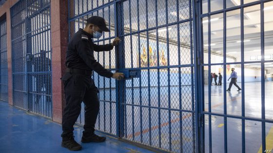 A guard locks one of the gates inside the prison of Kenitra, in the coastal city of the same name, near the Moroccan capital Rabat, on August 31, 2021. - After passing through the North African kingdom's Moussalaha ("Reconciliation") programme, some prisoners are hoping for a reprieve. The programme, launched in 2015 and led by Morocco's DGAPR prison service with several partner organisations, aims to help terror detainees who are willing to question their beliefs. (Photo by FADEL SENNA / AFP)