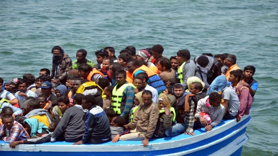 Migrants arrive at the port in the Tunisian town of Ben Guerdane, some 40 kilometres west of the Libyan border, following their rescue by Tunisia's coastguard and navy after their vessel overturned off Libya, on June 10, 2015. 354 migrants were rescued from two boats which broke down as they headed from Libya to Italy, the Red Crescent and an AFP correspondent said. AFP PHOTO / FETHI NASRI (Photo credit should read FETHI NASRI/AFP via Getty Images)